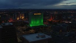 5.7K aerial stock footage of flying by the Wells Fargo Building at twilight, Downtown Albuquerque, New Mexico Aerial Stock Footage | DX0002_128_025