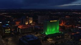 5.7K aerial stock footage approach and flyby office buildings and Wells Fargo Building at twilight, Downtown Albuquerque, New Mexico Aerial Stock Footage | DX0002_128_038