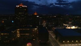 5.7K aerial stock footage flyby city street, high-rise office building and hotel at twilight, Downtown Albuquerque, New Mexico Aerial Stock Footage | DX0002_128_041