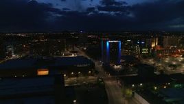 5.7K aerial stock footage flyby auditorium, hotel and reveal office building at twilight, Downtown Albuquerque, New Mexico Aerial Stock Footage | DX0002_128_042