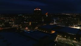 5.7K aerial stock footage orbiting office high-rise beside hotel at twilight, reveal auditorium, Downtown Albuquerque, New Mexico Aerial Stock Footage | DX0002_128_044