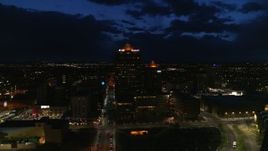 5.7K aerial stock footage circling an office high-rise and hotel at twilight, Downtown Albuquerque, New Mexico Aerial Stock Footage | DX0002_128_048