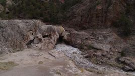 5.7K aerial stock footage of orbiting river rapids flowing through a rock formation in the mountains in New Mexico Aerial Stock Footage | DX0002_129_002