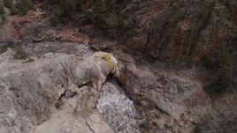 5.7K aerial stock footage bird's eye view of river rapids flowing through a rock formation in the mountains in New Mexico Aerial Stock Footage | DX0002_129_006