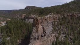 5.7K aerial stock footage of orbiting a rock formation jutting from a mountain in New Mexico Aerial Stock Footage | DX0002_129_012