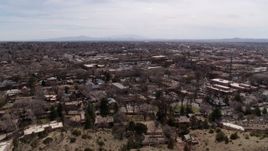 5.7K aerial stock footage flying by the downtown area of Santa Fe during ascent, New Mexico Aerial Stock Footage | DX0002_129_017