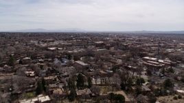 5.7K aerial stock footage ascend and flyby the downtown area and surrounding city of Santa Fe, New Mexico Aerial Stock Footage | DX0002_129_024