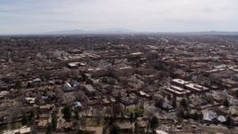 5.7K aerial stock footage wide orbit around the downtown area, with view of surrounding city of Santa Fe, New Mexico Aerial Stock Footage | DX0002_129_025