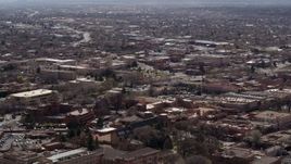 5.7K aerial stock footage flying past city buildings in the downtown area of Santa Fe, New Mexico Aerial Stock Footage | DX0002_129_028
