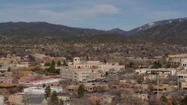 5.7K aerial stock footage of passing by Bataan Memorial Building near capitol building, Santa Fe, New Mexico Aerial Stock Footage | DX0002_129_044