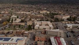 5.7K aerial stock footage fly away from Bataan Memorial Building and state capitol building, Santa Fe, New Mexico Aerial Stock Footage | DX0002_130_008