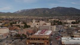 5.7K aerial stock footage orbit Bataan Memorial Building, state capitol in background, Santa Fe, New Mexico Aerial Stock Footage | DX0002_130_010