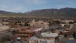 5.7K aerial stock footage an orbit of state government offices and shops, state capitol in background, Santa Fe, New Mexico Aerial Stock Footage | DX0002_130_011