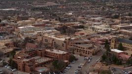 5.7K aerial stock footage of a reverse view of two hotels in Santa Fe, New Mexico Aerial Stock Footage | DX0002_130_026