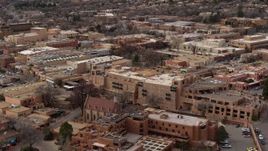 5.7K aerial stock footage descend past two hotels in Santa Fe, New Mexico Aerial Stock Footage | DX0002_130_032