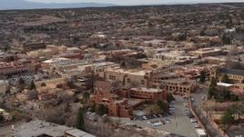 5.7K aerial stock footage passing downtown hotels to reveal a cathedral in Santa Fe, New Mexico Aerial Stock Footage | DX0002_130_037