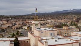 5.7K aerial stock footage orbiting tower and flags on Bataan Memorial Building, Santa Fe, New Mexico Aerial Stock Footage | DX0002_131_011