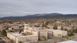 5.7K aerial stock footage of passing the Bataan Memorial Building for wide view of downtown, Santa Fe, New Mexico Aerial Stock Footage | DX0002_131_015