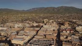 5.7K aerial stock footage slowly flying by downtown buildings in Santa Fe, New Mexico Aerial Stock Footage | DX0002_132_009