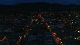 5.7K aerial stock footage ascend by downtown, reveal San Francisco Street leading to cathedral at night, Santa Fe, New Mexico Aerial Stock Footage | DX0002_132_018