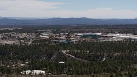 5.7K aerial stock footage ascend while slowly passing Los Alamos National Laboratory, New Mexico Aerial Stock Footage | DX0002_133_023