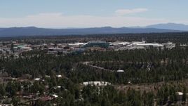 5.7K aerial stock footage wide reverse view of the Los Alamos National Laboratory, New Mexico Aerial Stock Footage | DX0002_133_029