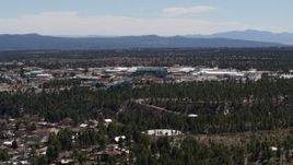5.7K aerial stock footage wide view of the Los Alamos National Laboratory during ascent, New Mexico Aerial Stock Footage | DX0002_133_030