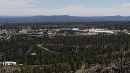 5.7K aerial stock footage ascend while flying by the Los Alamos National Laboratory complex, New Mexico Aerial Stock Footage | DX0002_133_038