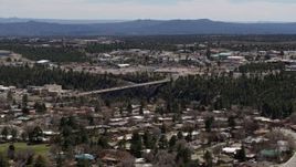 5.7K aerial stock footage cars crossing bridge spanning the canyon to the Los Alamos National Laboratory, New Mexico Aerial Stock Footage | DX0002_133_041