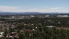 5.7K aerial stock footage ascend from trees, reveal Los Alamos National Laboratory, New Mexico Aerial Stock Footage | DX0002_134_001