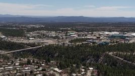 5.7K aerial stock footage ascend and fly away from bridge across canyon and Los Alamos National Laboratory, New Mexico Aerial Stock Footage | DX0002_134_005