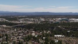 5.7K aerial stock footage of bridge across canyon and Los Alamos National Laboratory during descent, New Mexico Aerial Stock Footage | DX0002_134_006