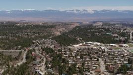 5.7K aerial stock footage distant mountains seen from neighborhoods near mesas and canyons in Los Alamos, New Mexico Aerial Stock Footage | DX0002_134_009