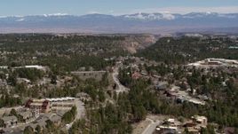 5.7K aerial stock footage road near homes and mesas with a view of mountains in Los Alamos, New Mexico Aerial Stock Footage | DX0002_134_012