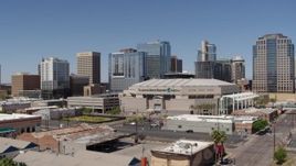 5.7K aerial stock footage of passing the arena near office buildings in Downtown Phoenix, Arizona Aerial Stock Footage | DX0002_136_001