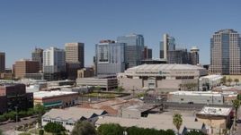 5.7K aerial stock footage of flying away from the arena and office buildings in Downtown Phoenix, Arizona Aerial Stock Footage | DX0002_136_002