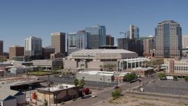 5.7K aerial stock footage of flying by condo complex to focus on the arena in Downtown Phoenix, Arizona Aerial Stock Footage | DX0002_136_010