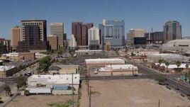 5.7K aerial stock footage of a reverse view of tall office buildings in Downtown Phoenix, Arizona Aerial Stock Footage | DX0002_136_026