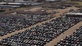 5.7K aerial stock footage of ascending with a view of cars at an automobile junkyard in Phoenix, Arizona Aerial Stock Footage | DX0002_136_041