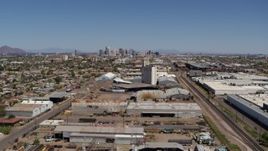 5.7K aerial stock footage train tracks, grain elevator, and city skyline in Downtown Phoenix, Arizona Aerial Stock Footage | DX0002_137_007