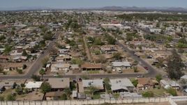 5.7K aerial stock footage an orbit of urban homes in Phoenix, Arizona Aerial Stock Footage | DX0002_137_013