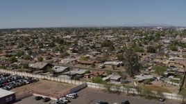 5.7K aerial stock footage of descending near urban homes in Phoenix, Arizona Aerial Stock Footage | DX0002_137_015