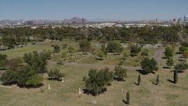 5.7K aerial stock footage of an orbit of graves at a cemetery in Phoenix, Arizona Aerial Stock Footage | DX0002_137_023