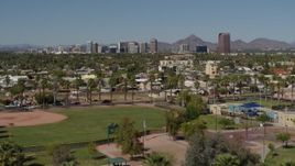 5.7K aerial stock footage a wide view of tall office buildings seen from city park in Phoenix, Arizona Aerial Stock Footage | DX0002_137_041