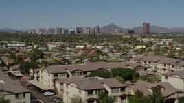 5.7K aerial stock footage a view of tall office buildings seen from city park and apartment buildings in Phoenix, Arizona Aerial Stock Footage | DX0002_137_042