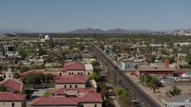 5.7K aerial stock footage flying by 15th Avenue and residential neighborhood in Phoenix, Arizona Aerial Stock Footage | DX0002_137_043