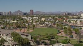 5.7K aerial stock footage BMO Tower seen while flying by University Park in Phoenix, Arizona Aerial Stock Footage | DX0002_137_045