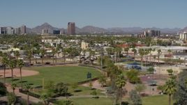5.7K aerial stock footage BMO Tower seen from University Park in Phoenix, Arizona Aerial Stock Footage | DX0002_137_048