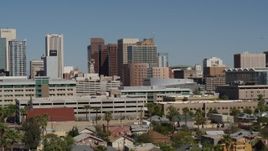 5.7K aerial stock footage of a reverse view of towering office buildings in Downtown Phoenix, Arizona Aerial Stock Footage | DX0002_137_055