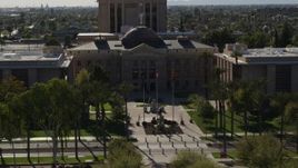 5.7K aerial stock footage of a reverse view of the Arizona State Capitol building in Phoenix, Arizona Aerial Stock Footage | DX0002_137_063